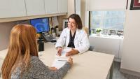 Dr. Paula Brady in conversation with a patient