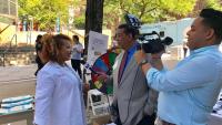 Ashanda Saint Jean, MD speaks to local media at the Healthy Haven festival